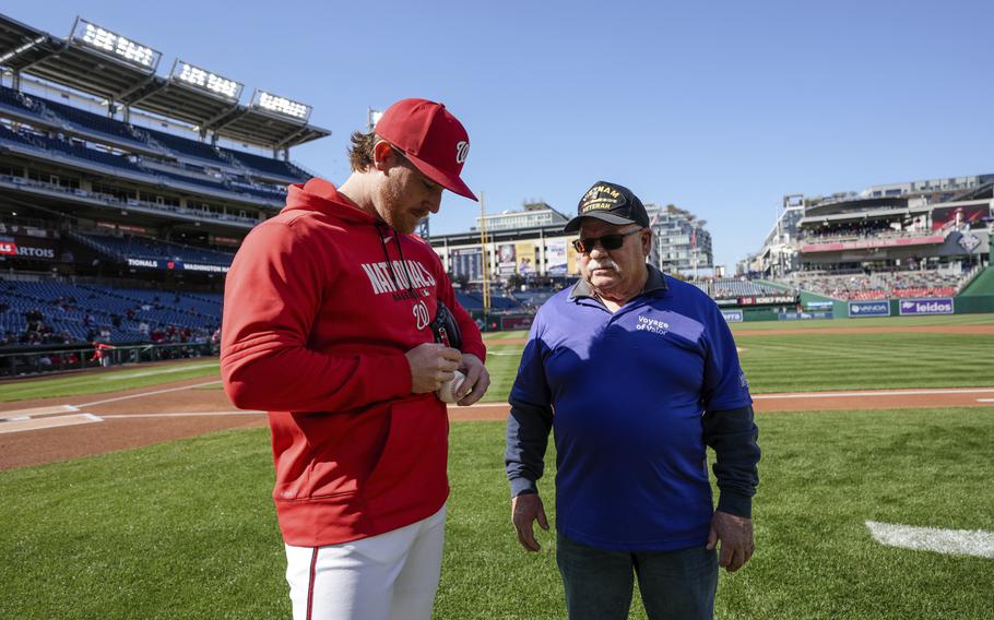 Beeter stands next to Ferrero on the field.